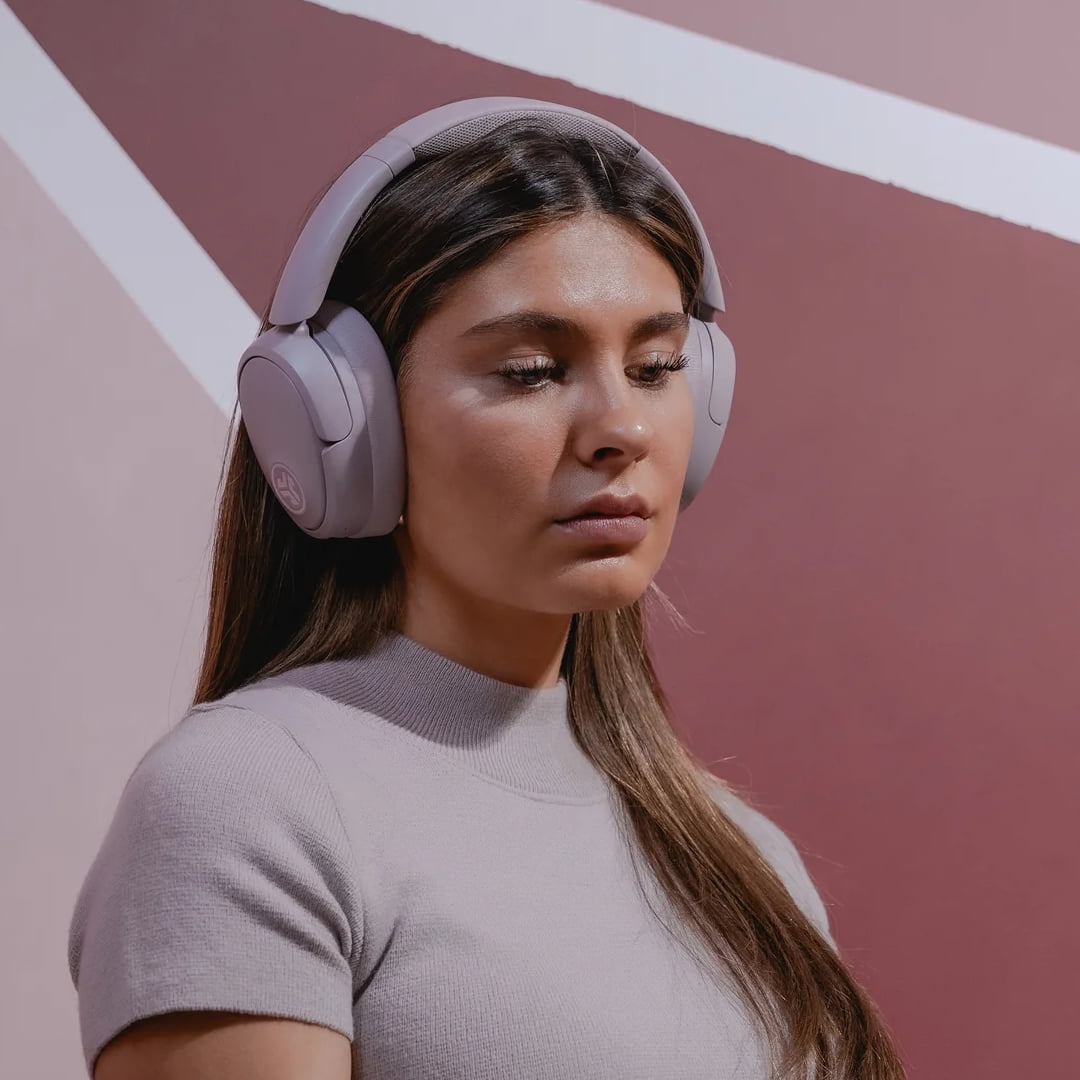 JLab JBuds Lux Over Ear ANC Headphones in Mauve on Woman Lifestyle