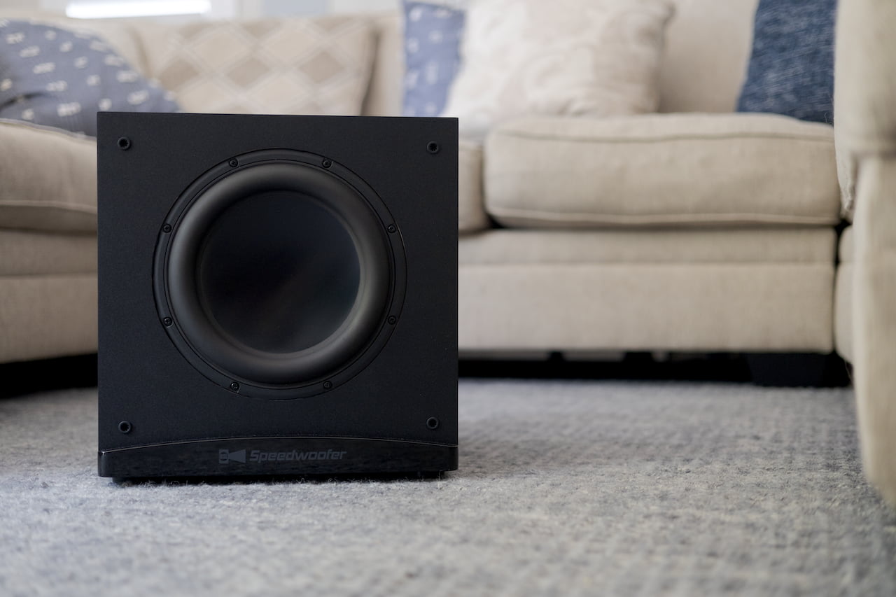 RSL Speedwoofer 10S MKII in front of couch without grille